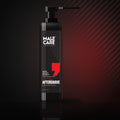 Signature Aftershave Skin Moist Effect, black pump bottle on a dark reflective surface with red accent light