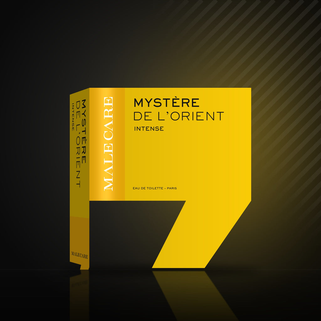 Mystère de l'Orient Eau de Toilette yellow box, MALE CARE Intense line, on a dark reflective surface
