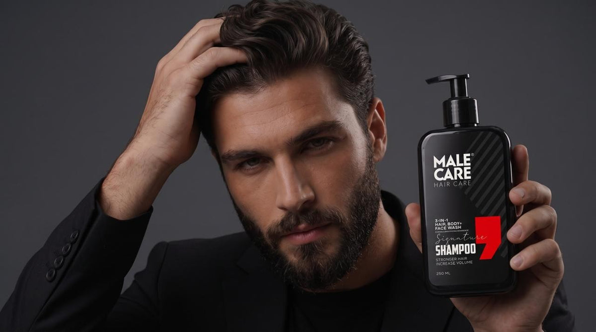 Well-groomed man holding MALE CARE Signature 3-in-1 Shampoo